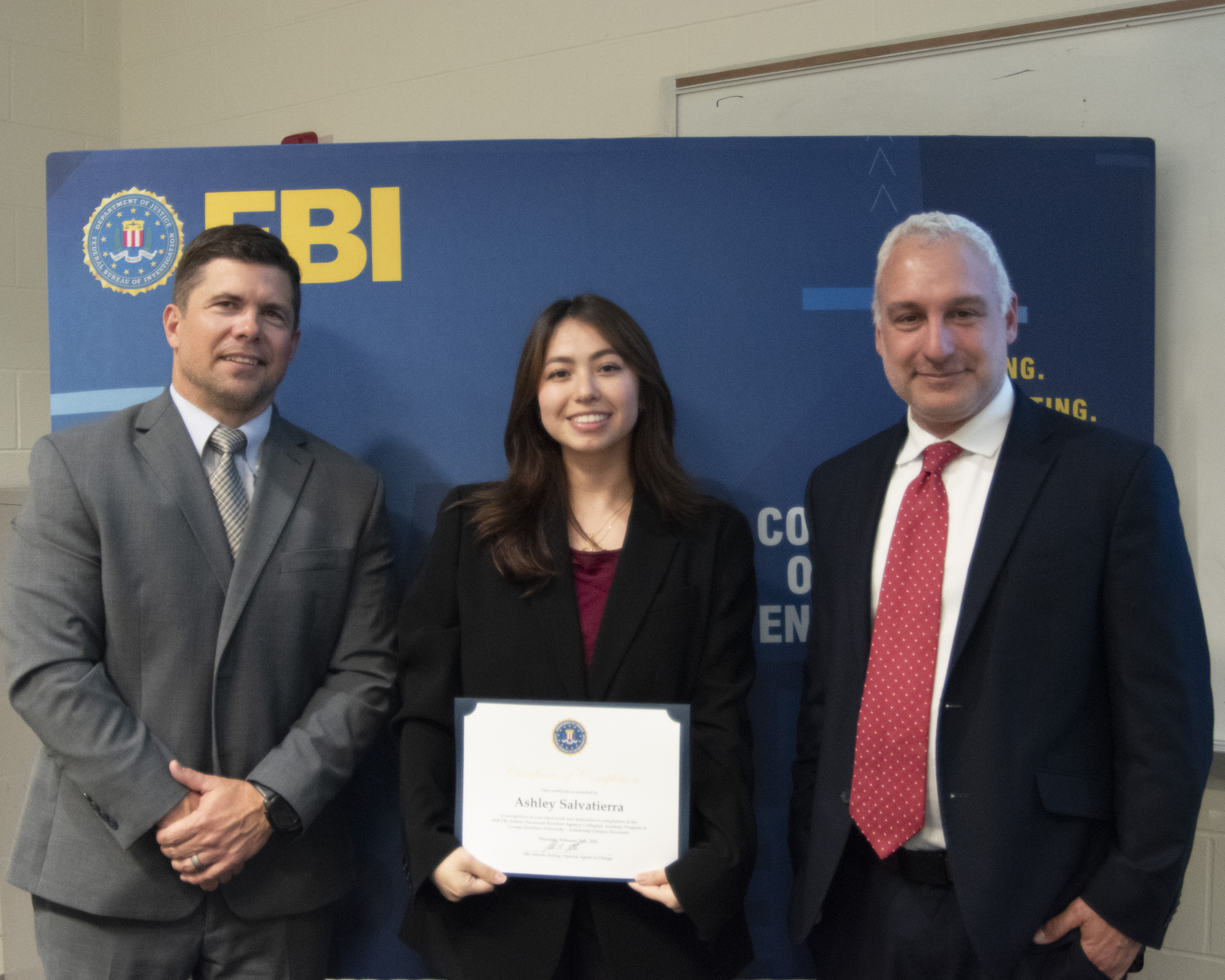 Photo of me alongside Special Agents graduating from the Collegiate Academy.